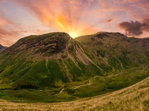 Preview wallpaper mountains, peaks, sunset, grass, meadow