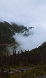 Preview wallpaper mountains, pines, trees, fog, road, car, nature