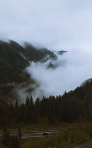 Preview wallpaper mountains, pines, trees, fog, road, car, nature