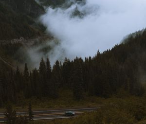 Preview wallpaper mountains, pines, trees, fog, road, car, nature