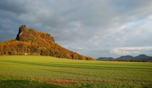 Preview wallpaper mountains, plain, clouds, grass, green, trees, shadow