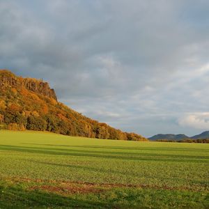 Preview wallpaper mountains, plain, clouds, grass, green, trees, shadow