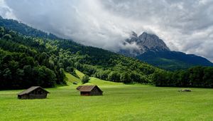 Preview wallpaper mountains, plain, lodges, clouds, smoke, sky