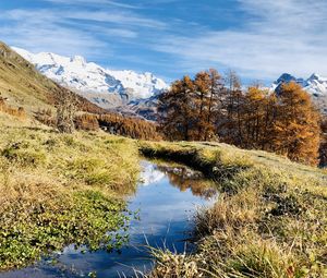 Preview wallpaper mountains, puddle, trees, grass, landscape, nature