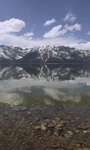 Preview wallpaper mountains, reflection, lake, bottom, stones, sky, clouds