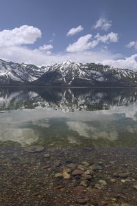 Preview wallpaper mountains, reflection, lake, bottom, stones, sky, clouds