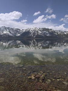 Preview wallpaper mountains, reflection, lake, bottom, stones, sky, clouds