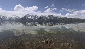 Preview wallpaper mountains, reflection, lake, bottom, stones, sky, clouds