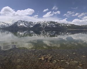 Preview wallpaper mountains, reflection, lake, bottom, stones, sky, clouds