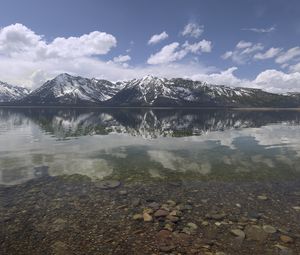 Preview wallpaper mountains, reflection, lake, bottom, stones, sky, clouds