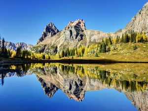 Preview wallpaper mountains, reflection, sky, grass, lake
