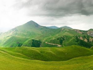 Preview wallpaper mountains, relief, green, cloudy