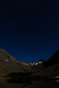Preview wallpaper mountains, relief, lake, starry sky, night