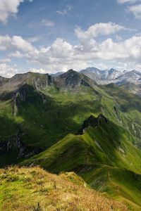 Preview wallpaper mountains, relief, shadows, sharp, clouds, sky, height, landscape, movement