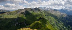 Preview wallpaper mountains, relief, shadows, sharp, clouds, sky, height, landscape, movement