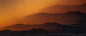 Preview wallpaper mountains, relief, silhouettes, bridge, sunset, dark, illusion