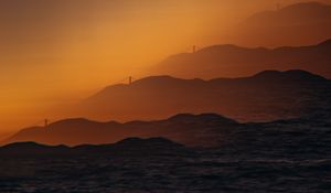 Preview wallpaper mountains, relief, silhouettes, bridge, sunset, dark, illusion