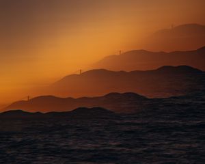 Preview wallpaper mountains, relief, silhouettes, bridge, sunset, dark, illusion