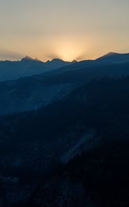 Preview wallpaper mountains, relief, sun, rays, twilight, dark