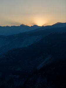 Preview wallpaper mountains, relief, sun, rays, twilight, dark