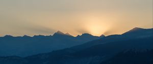 Preview wallpaper mountains, relief, sun, rays, twilight, dark