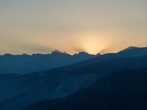 Preview wallpaper mountains, relief, sun, rays, twilight, dark