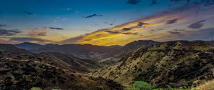 Preview wallpaper mountains, relief, sunset, bushes, sky