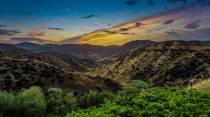 Preview wallpaper mountains, relief, sunset, bushes, sky
