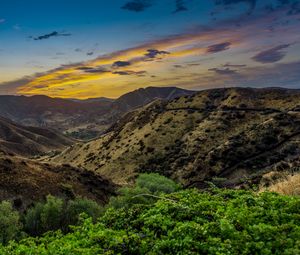 Preview wallpaper mountains, relief, sunset, bushes, sky