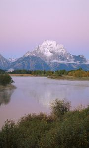 Preview wallpaper mountains, river, coast, vegetation, evening, trees, tops, clouds