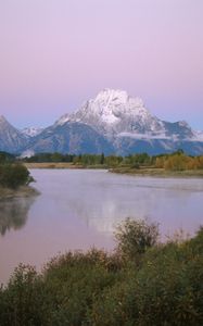 Preview wallpaper mountains, river, coast, vegetation, evening, trees, tops, clouds