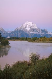 Preview wallpaper mountains, river, coast, vegetation, evening, trees, tops, clouds