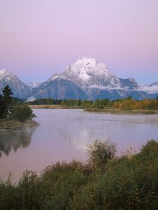 Preview wallpaper mountains, river, coast, vegetation, evening, trees, tops, clouds