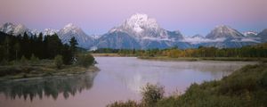 Preview wallpaper mountains, river, coast, vegetation, evening, trees, tops, clouds