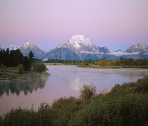 Preview wallpaper mountains, river, coast, vegetation, evening, trees, tops, clouds