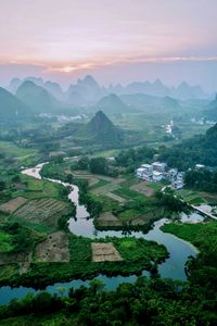 Preview wallpaper mountains, river, grass, distance, landscape