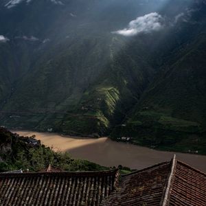 Preview wallpaper mountains, river, roofs, pagodas, clouds