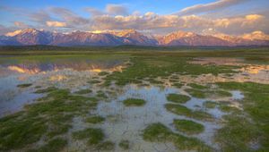 Preview wallpaper mountains, river, vegetation, evening, bottom, cracks