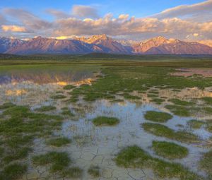 Preview wallpaper mountains, river, vegetation, evening, bottom, cracks