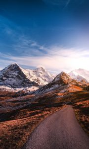 Preview wallpaper mountains, road, asphalt, peaks, snow, sky, switzerland