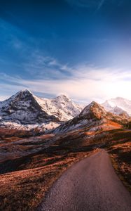 Preview wallpaper mountains, road, asphalt, peaks, snow, sky, switzerland