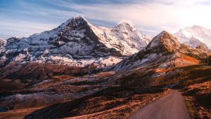 Preview wallpaper mountains, road, asphalt, peaks, snow, sky, switzerland