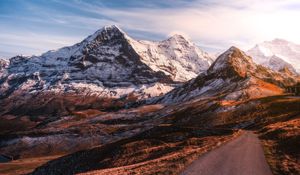 Preview wallpaper mountains, road, asphalt, peaks, snow, sky, switzerland