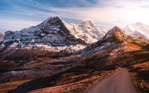 Preview wallpaper mountains, road, asphalt, peaks, snow, sky, switzerland