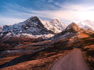 Preview wallpaper mountains, road, asphalt, peaks, snow, sky, switzerland