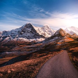 Preview wallpaper mountains, road, asphalt, peaks, snow, sky, switzerland