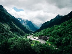 Preview wallpaper mountains, road, car, clouds, norway