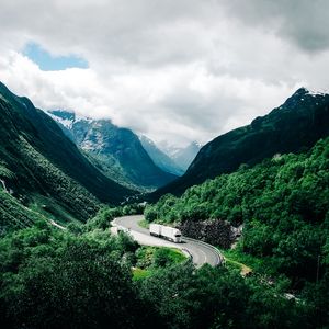 Preview wallpaper mountains, road, car, clouds, norway