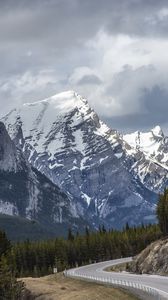 Preview wallpaper mountains, road, forest, snow, snowy