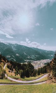 Preview wallpaper mountains, road, landscape, sun, trees, slope